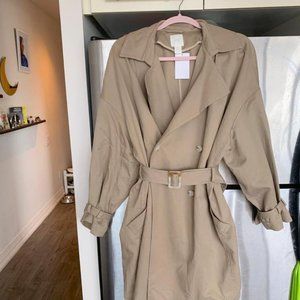 Beige trench coat with belt detail